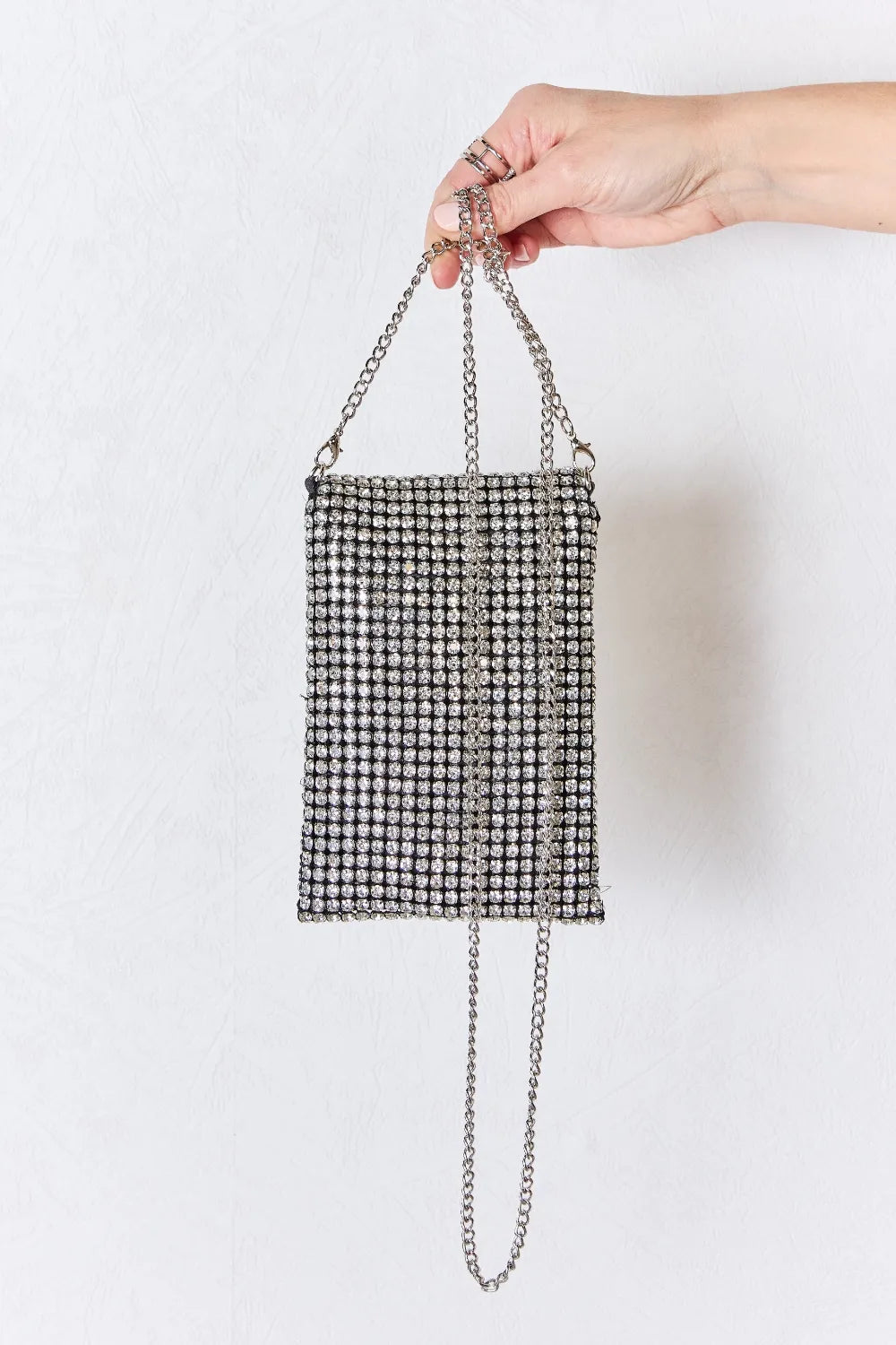 Back view of Chaos Spark Mini Rhinestone Crossbody Bag with silver chain strap