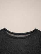 Close-up of the neckline on the Metallic Glitter Mesh Long Sleeve Top showing the sheer glitter fabric.