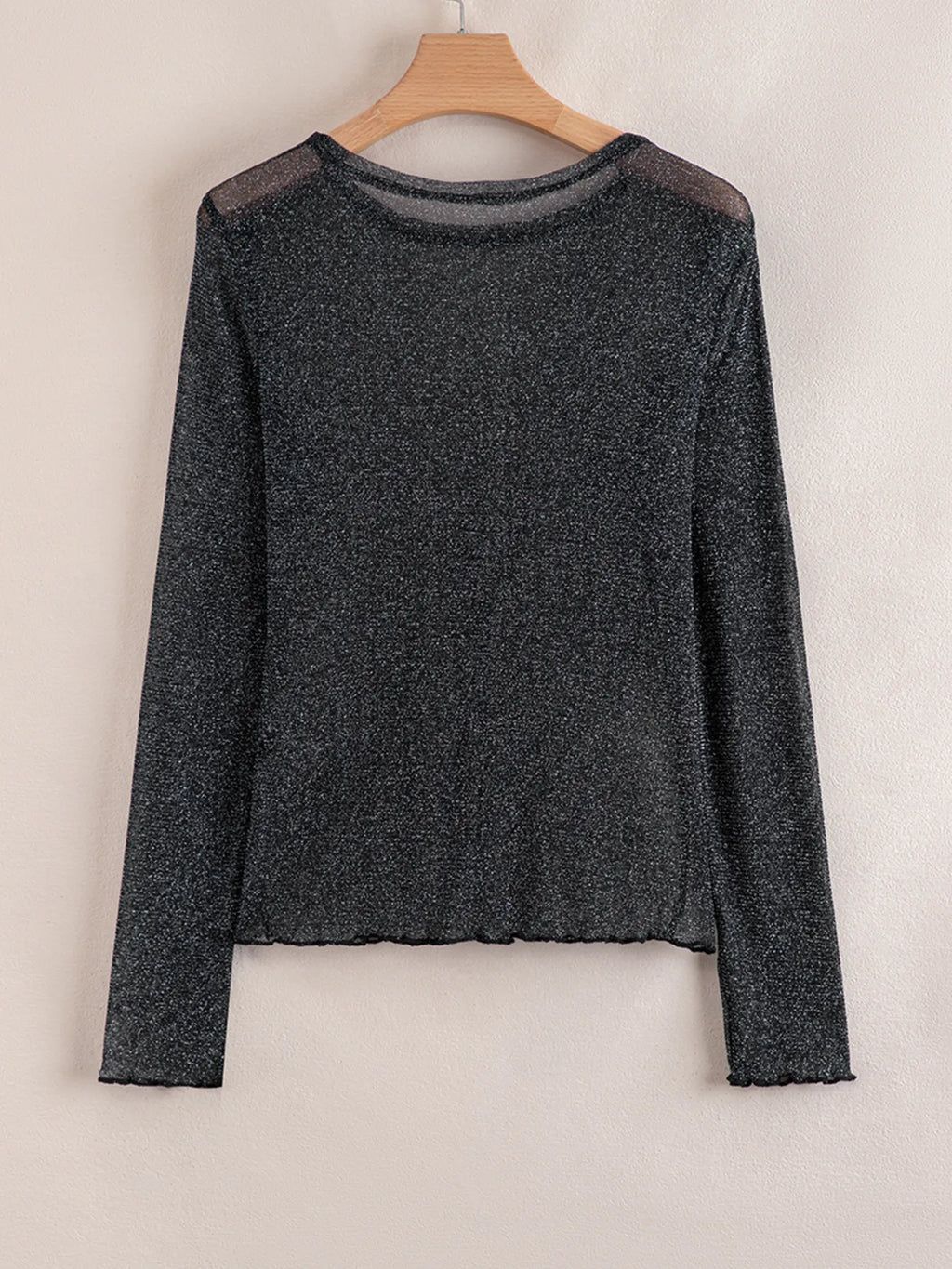 Flat lay of the Metallic Glitter Mesh Long Sleeve Top in black glitter mesh with long sleeves.